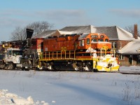 One of the new CN blower trucks was out first thing Saturday morning clearing switches in the yard at Stratford before the crew of GEXR 581 reported for duty. Pictured here, 581 is on its way to grab five hoppers from a much longer cut in the yard. The hoppers would be set of at Broadgrain Commodities east of Seaforth from where they would head light to <a href="http://www.railpictures.ca/?attachment_id=36245">Hensall</a>. For anybody wondering, as of Saturday, the plow was still sitting at the FS Partners east of Mitchell. There were some fairly sizable drifts on both the Goderich and Exeter Subs, but 581 just shoved through those on its own. Unfortunately, action on the Goderich Sub was backlit with the early morning departure, and they took the Exeter Sub so slowly that even the bigger drifts were mowed over without much in the way of flying snow.