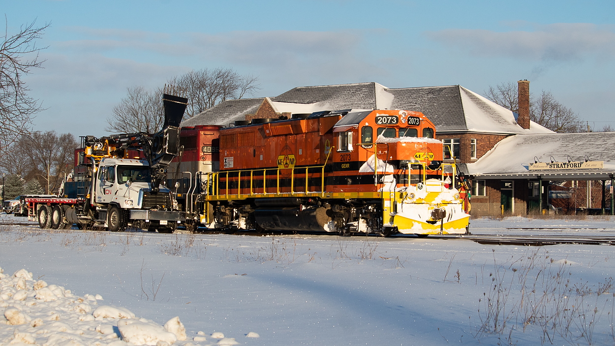 One of the new CN blower trucks was out first thing Saturday morning clearing switches in the yard at Stratford before the crew of GEXR 581 reported for duty. Pictured here, 581 is on its way to grab five hoppers from a much longer cut in the yard. The hoppers would be set of at Broadgrain Commodities east of Seaforth from where they would head light to Hensall. For anybody wondering, as of Saturday, the plow was still sitting at the FS Partners east of Mitchell. There were some fairly sizable drifts on both the Goderich and Exeter Subs, but 581 just shoved through those on its own. Unfortunately, action on the Goderich Sub was backlit with the early morning departure, and they took the Exeter Sub so slowly that even the bigger drifts were mowed over without much in the way of flying snow.