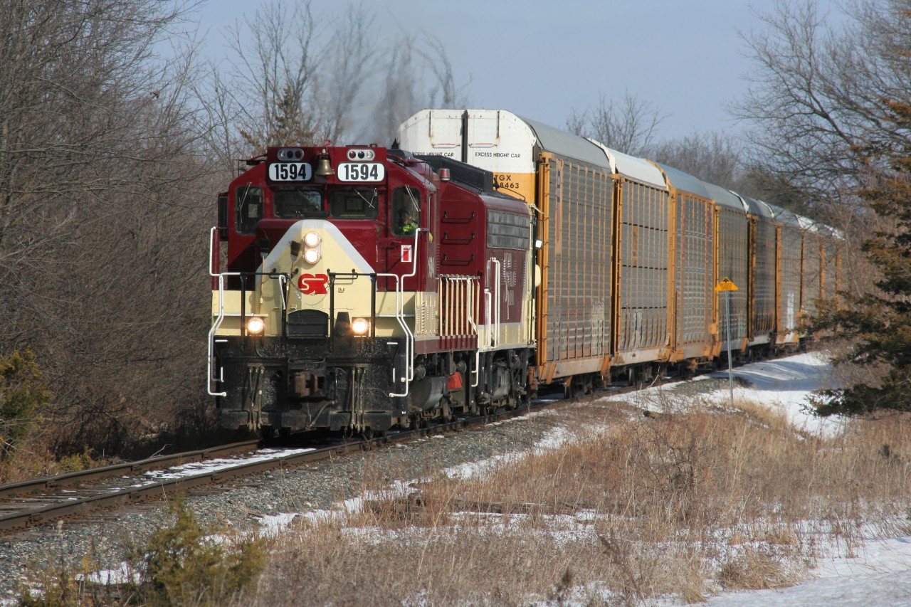 Ontario Southland Railway GP9u 1594 and FP9u 6508 have just departed Woodstock with cars lifted from Canadian Pacific and are passing a Reduce Speed sign as they head towards Beachville on the former CP St. Thomas Subdivision.