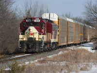 Ontario Southland Railway GP9u 1594 and FP9u 6508 have just departed Woodstock with cars lifted from Canadian Pacific and are passing a Reduce Speed sign as they head towards Beachville on the former CP St. Thomas Subdivision. 