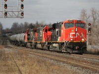 CN 2323, CN 5408 and CN 2164 lead an eastbound train through Georgetown under a lucky break in the clouds. 