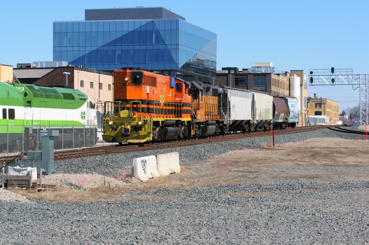 Goderich-Exeter Railway train 582 is passing Kitchener West and the GO Transit sets laying over for the weekend, as it departs westward for Stratford with GEXR 3030 and LLPX 2236, as well as a short cut of hoppers. The crew had just swapped out motive power in Kitchener, leaving GEXR 2073 and RLK 4095 behind.