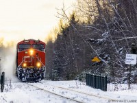 After sunrise, CN 3060 leads 848 axle empty potash train B731, as they head through Berry Mills, New Brunswick on a cold January morning. 