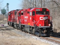 CP GP20C-ECO 2270, GP38-2 3113 and GP20C-ECO 2263 are seen on the Ayr Pit Spur in Ayr, Ontario during a late winter afternoon. The trio had reversed down to the FS Partners/Growmark facilities to lift several awaiting hoppers cars. However, upon arrival they found an unmanned track mobile blocking the hoppers. So with nobody there to move the track mobile they retreated light power back up to the Galt Subdivision and to their home base at the Wolverton yard. 