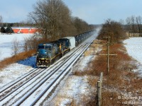 Image 1/2 in this series of the "lens of time and optics" - so on Sunday I found myself at Blenheim Rd near the Village of Canning just east of Princeton, I had not photographed anything here for about 15 years. After shooting this train and processing photos a few days later, I realized I had set aside a similar shot from 15 years ago to post here in the not too distant future, so I took effort to find the frame and crop that is closest to <a href=http://www.railpictures.ca/?attachment_id=36285 target=_blank> my photo of NS 327 </a> taken at the same spot. This reveals the cruel optics of time: No more NS, codeline is disintegrating, and the trees are getting taller and taller. The optical differences are, frankly, shooting using a D70 50mm f/1.8 fixed lens (cropped, 75mm equivalent) and now my D800 full frame, I shot this frame at 70mm and cropped it to be as close as possible. The rails are in exactly the same spot and the train is as close as I can get to the same as the NS shot. The building and codeline is damn close, but I chalk it to a slightly different vantage point and potential optical differences. The not so cruel optics of time? I Have a much higher quality camera now, and the smog is all but gone. Thank goodness for that!