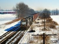 The lens of time and optics can reveal interesting facets in your photographic journey, 15 years ago I spent a beautiful sunny spring day with a friend photographing trains, got a few keepers and a few misses, but at Blenheim Rd I waited here for NS 327 to pass by with a pair of standard cab EMD units. In the optics of time, there's considerable haze in the distance owing to the increased pollution we put up with. And of course, NS trains in Ontario are basically gone. The village of Canning is in the far left corner. Compare to the modern day <a href=http://www.railpictures.ca/?attachment_id=36286> photo of M331 here</a>