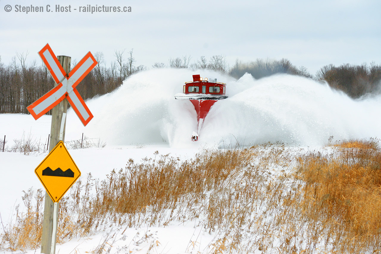 Where's winter? At least, in Southern Ontario - we're asking this question - as of January 9 it's yet to really arrive. Exactly one year ago, winter was in full blast mode and I had the pleasure of photographing  GEXR battling snow in the morning to Goderich  only to get a call about OSR doing the same thing. A Doubleshot? Pinch me. I made sure to pinch myself and booked it for Salford to get at least one shot of OSR - I only needed one. This is it. The plow broke after this shot was taken and needed repair, but my mission was accomplished. 
Five years ago today, I also had the pleasure of a doubleshot - OSR called a plow for 0800 out of Salford, so I spent a   gorgeous kodachrome morning photographing OSR  and afterwards I went home via Stratford, the long way, because I heard a plow may be out on GEXR. I got lucky - they still hadn't  plowed the Guelph sub. It will be interesting to see what CN does this winter in the St. Marys area, CN does have spreaders in the area - anyone know if CN has wedge plows in service or stored anywhere?. Both GEXR and OSR Still have their plows, crossing fingers they will have to pull it out and use it, if lucky, maybe on the same day.