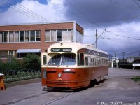 TTC PCC 4302 poses at Runnymede Loop (at the corner of Dundas Street West & Runnymede Road in the Junction area) at the end of its westbound run on the Dundas route, ready to head back east via Dundas Street all the way back to <a href=http://www.railpictures.ca/?attachment_id=30851><b>City Hall Loop</b></a>. The "Broadview Subway Station" terminus exposure is either up in error or posed for photos, as the station and new Bloor-Danforth subway line was still under construction and a number of months away from seeing any streetcar service. According to <a href=https://transit.toronto.on.ca/streetcar/4104.shtml><b>Transit Toronto</b></a>, the Dundas car would operate between Runnymede Loop to City Hall Loop until the subway opened in February 1966, after which every second Dundas car would run to Broadview Station. In May 1968 when the B-D subway extensions opened, the <a href=http://www.railpictures.ca/?attachment_id=35760><b>Dundas streetcar</b></a> would be cut back to Dundas West Station and replaced by a trolleybus service, which eventually became a diesel bus that still serves Runnymede Loop today.<br><br>The building in the background was home to the Dominion Bridge Company (and before that Runnymede Steel in the 50's), but at the time was in the process of "moving to larger premises" (they had other facilities in Dixie (Mississauga) and Mount Dennis (Toronto) at the time). CPR's Lambton/West Toronto yards are also visible, with a CGTX tank car spotted in the yard above the Runnymede Rd. subway (a term commonly used for underpasses/viaducts before Toronto got a real subway). And the orange newspaper box is for the Globe & Mail's Early Edition (Only) - just 10 cents on the honor system of payment.<br><br><i>John F. Bromley photo, Dan Dell'Unto collection.</i>