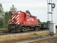 Sitting in the yard at Delson QC is a white flagged extra train powered by CP 8737, an MLW RS-18 in the wide diagonal stripes CP Rail paint scheme. <br> The signal number is 351, corresponding to CP Adirondack sub mileage 35.1 Delson.  It provides signal indications for trains entering the Adirondack sub off D&H / Napierville Junction Rwy track (as it was then, now CP's Lacolle Sub). This is very close to the grade crossing where I caught D&H 462 and train. 