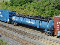 GATX's tank trainer car has a lot of fillers, vents, and drains - for educational purposes only. With the access door on its side, it would not make a good tank car.<br>
Right behind GATX 1993 were Classroom car GATX 101898 and boxcar GATX 101919, all in matching blue.<br>
They were seen in the middle of eastbound CN train 422, Port Robinson to Macmillan Yard.<br>
TankTrainer™ sessions are offered to customers, railroads, and first responders.

