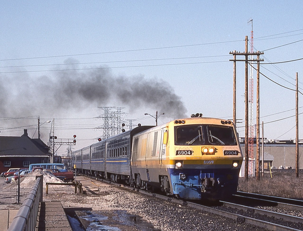 VIA 6904 is in Burlington, Ontario on March 26, 1984. That is the VIA station on the left.