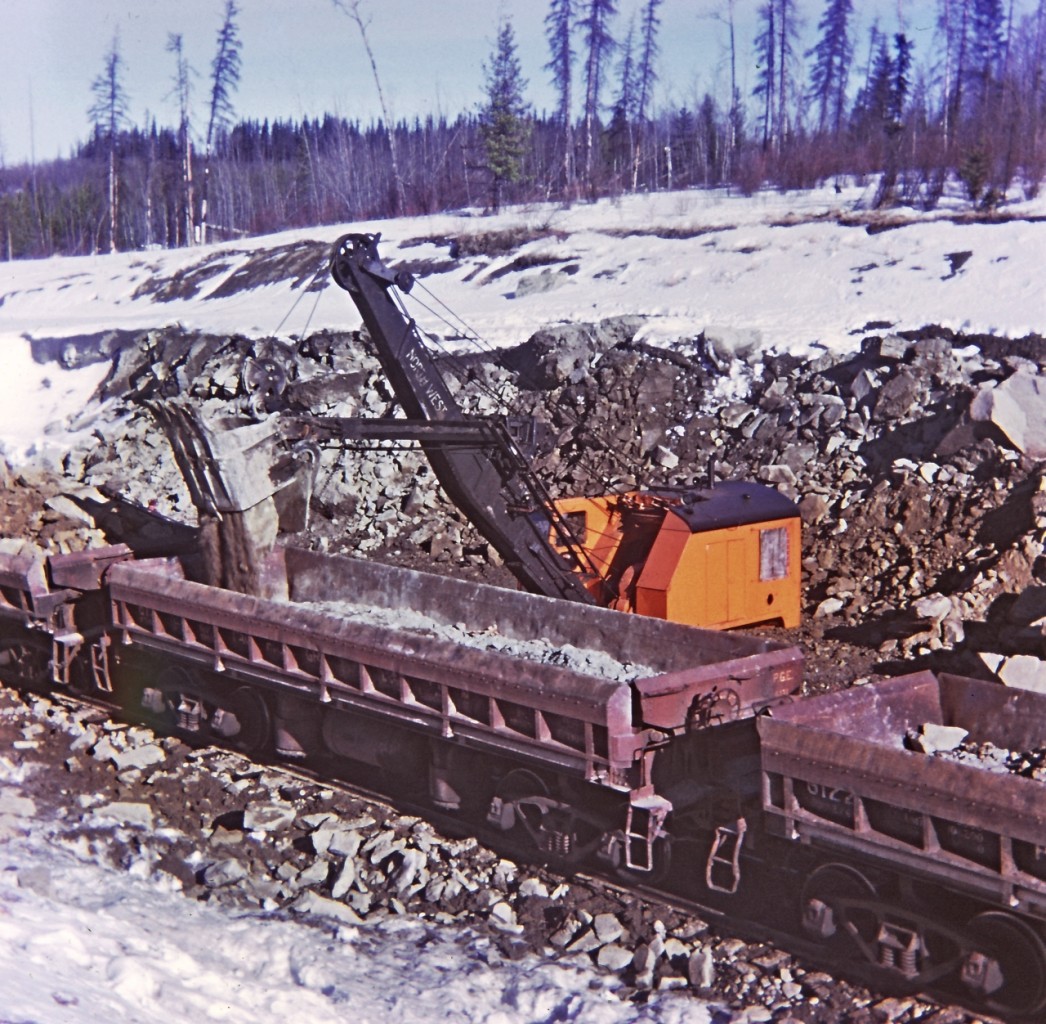 In work service, loading rock at mile 765 on the BCR Fort Saint John sub. We will dump the rock to stabilize the footings of the Blueberry River bridge at mile 771.4. This location is now on the Fort Nelson sub account changes in the employee time table and crew assignments.
The North West shovel was quite the machine, all done with cables, pulleys and an assortment of levers and foot pedals. Truly was operated by an "operating engineer", no computer aided joy stick hydraulics on this machine.

I was not able to locate this location on the map.
