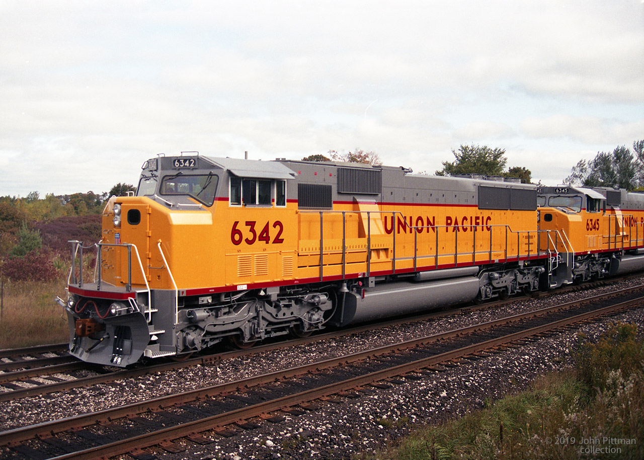 Factory fresh SD60M units UP 6342 and 6345. From the background, I suspect that the engines are on the GMDD test track in London ON, or going to CP Quebec Street yard. Map location is approximate.  Date is from an online source of build date. I would appreciate feedback from the rpca community. 
The UP colour scheme (before adoption of the big flag) was one of my favorites, and it helps that the trucks,  fuel tank, etc are not black.