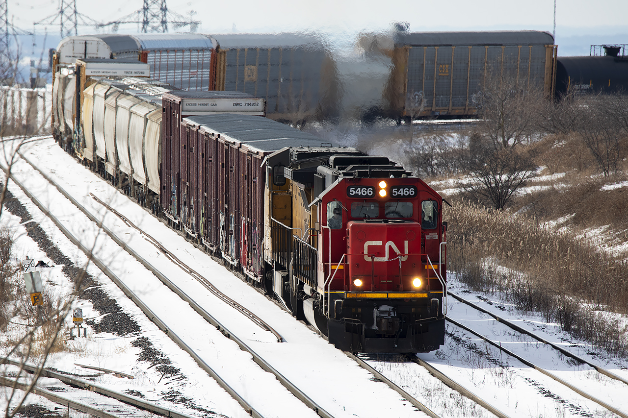 306 heads out York 2 starting the long trip to Moncton. GECX 9133 trails