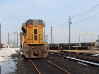 On the south side of the diesel shop UP SD70ACe waits for pickup by the turntable. The turntable sides are covered with black tarps to minimize drifting snow accumulating into the pit and slowing/stopping it's operation.