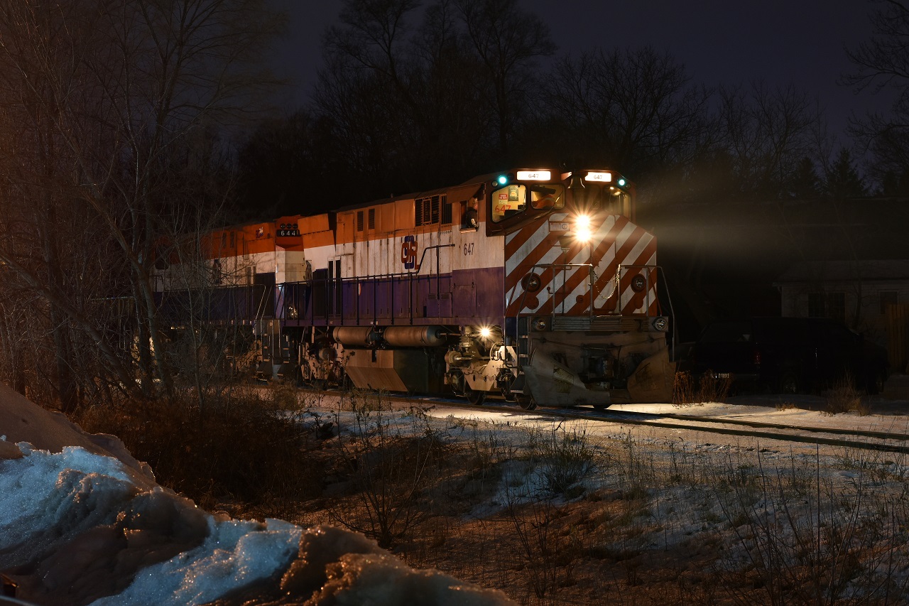 Pausing momentarily while working Guelph's South end, OSR 647's green class lights glow in the night sky