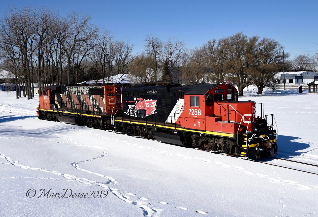 New power on the IOX job in Sarnia with the addition of CN 7248 paired with CN 4784 as they run light to pick up a cut of full hoppers at the elevator.