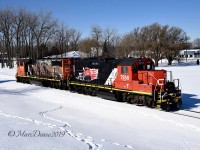 New power on the IOX job in Sarnia with the addition of CN 7248 paired with CN 4784 as they run light to pick up a cut of full hoppers at the elevator.
