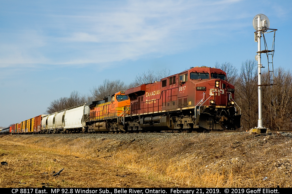 With a wave from the Engineer of train 2-234, CP 8817, with BNSF 5357 second up, rolls past signal 92.8 on the Windsor Sub today.  CP has been clearing brush along the Windsor sub and has made some shots possible that have not been for quite some time.  Thanks CP.........