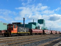 Retired CN SW1200 7304 is switching CN's Parkdale Steel Centre in Hamilton next to the Grimsby Sub. The sun and blue sky cooperated as the crew pushed this cut into the steel centre for processing.
