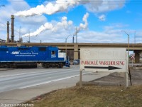 Saturday afternoon switch at Parkdale Warehousing in Hamilton's "far east" industrial area. CN is using GMTX 2264 and CN 7046 to pickup a single boxcar from the stub end track. Once ready, the crew will protect the crossing and head back to Stuart Street.