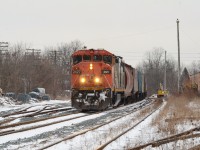 CN X431 has solo CN 2427 leading the way out of Guelph with a long cut of hoppers 