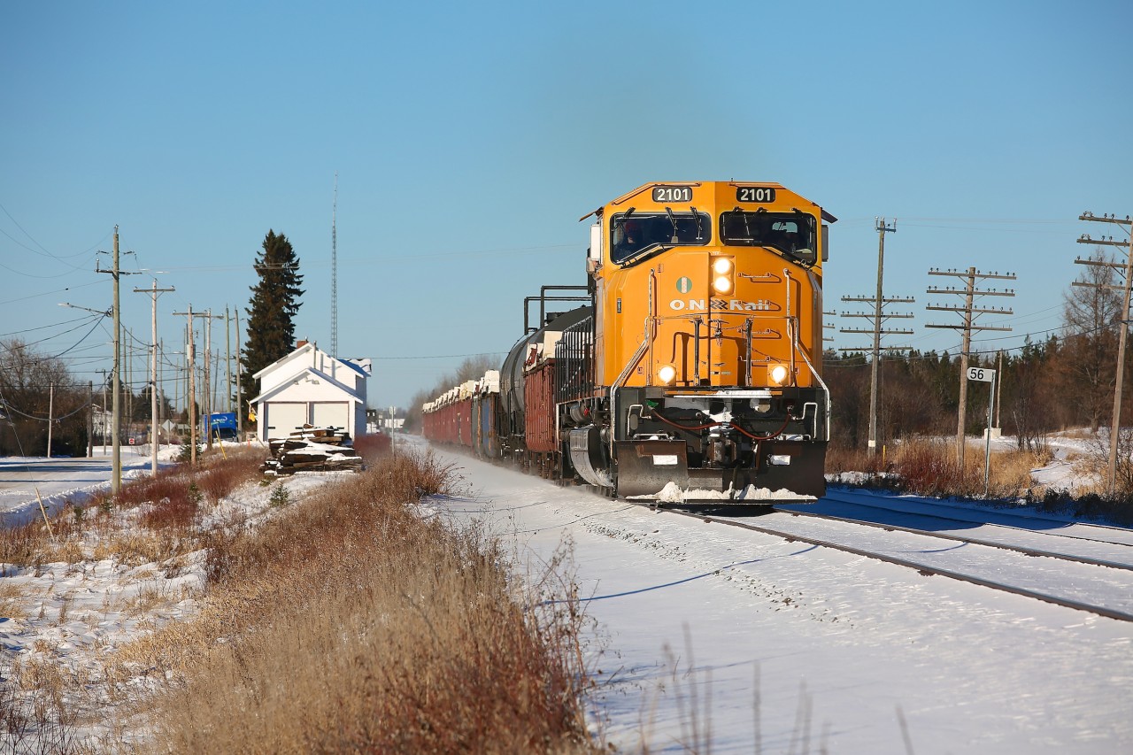 A lone SD75I powers train 308 through Ramore, Ontario on a nice November afternoon.  The white building to the left was once the train station, it has since been repurposed as the town's fire hall and is currently being used by the volunteer fire service.  Unfortunately, the building seems to have a bleak future - a January 16 report recommends that the building be demolished (and a new fire hall be built) due to numerous issues (structural/health and safety) with the building.