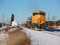 A lone SD75I powers train 308 through Ramore, Ontario on a nice November afternoon.  The white building to the left was once the train station, it has since been repurposed as the town's fire hall and is currently being used by the volunteer fire service.  Unfortunately, the building seems to have a bleak future - a January 16 report recommends that the building be demolished (and a new fire hall be built) due to numerous issues (structural/health and safety) with the building.