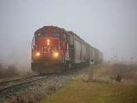 After spending a foggy morning working Thompsons, 7025 heads back towards Chatham with a dozen or so cars trailing behind.  