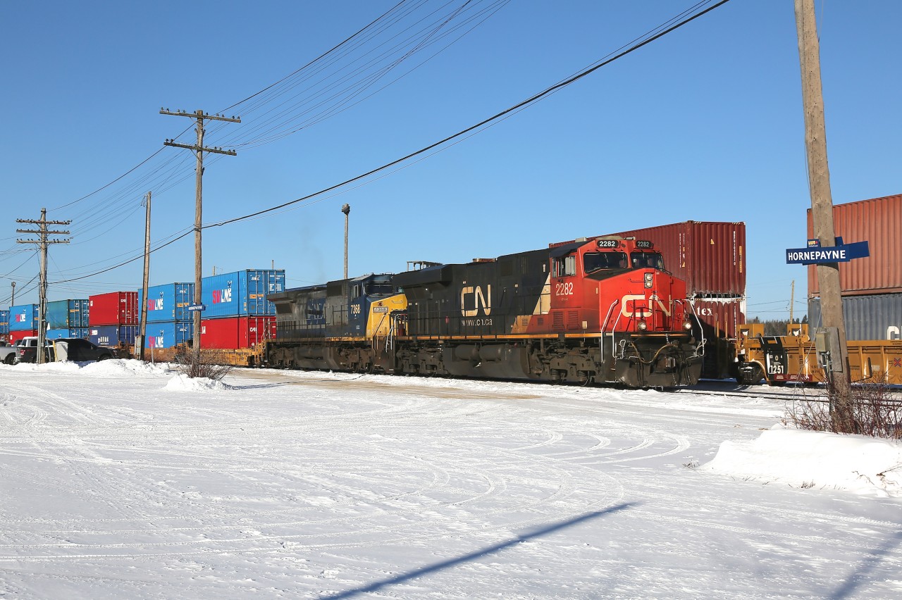 X102 idles in Hornepayne while waiting for a couple westbound trains to pass before continuing on towards Capreol and points east.