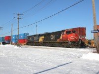 X102 idles in Hornepayne while waiting for a couple westbound trains to pass before continuing on towards Capreol and points east.