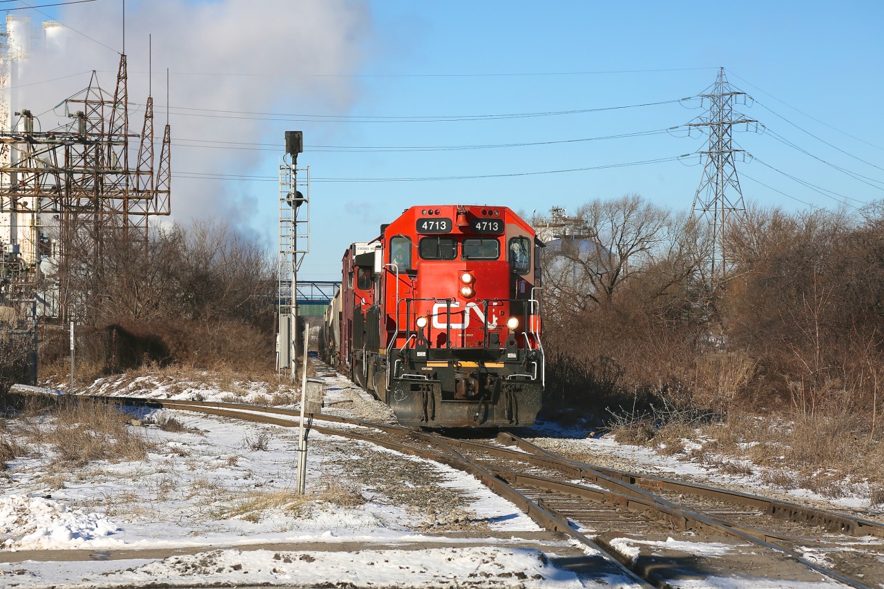 CN 4713 and 4781 bring the 0700 local down into CN's Hamilton industrial trackage.  They are seen about to cross CP's Beach Branch, on which minutes before CP TH31 had passed over.  I haven't spent much time in Hamilton and find it to be a fun, and sometimes frustrating, chase as the locals seem to appear and disappear at will down a tangled web of tracks.  A big thanks to Jamie Knott for all the information shared about these operations, and to Steve Host, whose informative photo captions have made a huge difference in understanding the overall track layout.