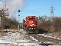 CN 4713 and 4781 bring the 0700 local down into CN's Hamilton industrial trackage.  They are seen about to cross CP's Beach Branch, on which minutes before CP TH31 had passed over.  I haven't spent much time in Hamilton and find it to be a fun, and sometimes frustrating, chase as the locals seem to appear and disappear at will down a tangled web of tracks.  A big thanks to Jamie Knott for all the information shared about these operations, and to Steve Host, whose informative photo captions have made a huge difference in understanding the overall track layout.