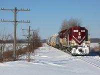 Ontario Southland locomotives 383 and 503 are on their way with a train to south Tillsonburg and Courtland.  Due to the ex CP bridge in Tillsonburg over Big Otter Creek being out of service, OSR serves south Tillsonburg/Courtland via the Cayuga Spur.  On this morning the power ran light to St Thomas, where they picked up a cut of cars that had been left by CN in the yard.  From there they headed east along the Cayuga Spur and, from what I was told, had work to do in south Tillsonburg and Courtland (I did not pursue them farther than Alymer) before retracing their steps and heading back to Salford.