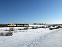 Another daylight viewing opportunity for VIA #1.  This time about 30 hours late cruising through Uncas at a leisurely 40 mph behind two freight trains.  Worth the -30C temp to see 40th Anniversary 6402 in the lead followed by 6410 and 6435.