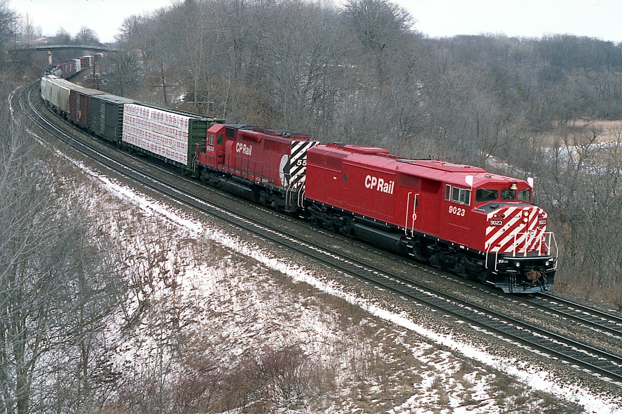 Looking back, I cannot recall seeing many of those SD-40F "Barns" running thru Bayview on CP. So it was a surprise to see one two days in a row on the Starlite, a Toronto-Hamilton and return train. The first time I saw it was from the highway.......and so, on a whim,  went back the next day and parked at the RBG Walkbridge and got lucky. Nice and clean looking, it was barely a year old in this shot....Second unit is CP 5508. Most all of the series (9000-9024 were  not around long; and by 2015 this unit was sold to the Central Maine & Quebec, where it languishes to this day.
