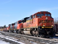BNSF 9222, CN 5735, and IC 2702 lead CN Q14891 15 with 157 cars.