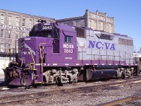 When GEXR had this locomotive on loan, it took the nickname "Barney" from the railfans. Most of you will know that Barney was the name of that silly dinosaur featured on some kiddie show I have forgotten the name of. As much as I detested that big purple fleabag, I really liked this purple locomotive. A paint scheme like no other we have seen around here. And so this image deserves a spot on Railpictures.
The North Carolins/Virginia Rwy is but a 49 mile line, mostly in North Carolina. It started up in 1987. Barney is no longer with the GEXR, but went to New England Central in 2006. I hope it has not been painted to the sickly orange, as all three roads mentioned here are now part of the Genesee & Wyoming family.
Most of you will recognize this image was taken opposite the VIA station in Kitchener.