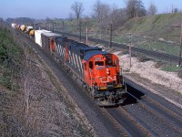 CN 2006 and helper 2012 head east with train 410 at mile 5.8 on the CN's Strathroy Sub. The CP's Windsor Sub is to the right.