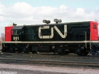 Now sporting modern CN colours as well as a pair of spark arrestors, CN G12 991 is seen parked at St. Thomas in 1969, not too long before being sent out west to BC with former LP&S <a href=http://www.railpictures.ca/?attachment_id=36586><b>sister unit 992</b></a>. There were subtle differences between the two units, including truck type and cab style.