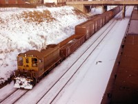 On a winter's day in early 1962, SW1200RS 1319 leads a wayfreight past commuter coaches at the Hamilton station towards Stuart Street yard.