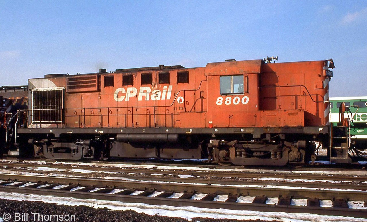 CP RS18 8800 is pictured trailing on a freight passing through Guelph Junction. Unit 8800 was the last MLW RS18 built for CP and the only one in the 8800-series (8729-8800), competed and delivered in July 1958. CP started rebuilding and chop-nosing their fleet of 251-powered RS18's in the early 1980's, and 8800 was cycled into the shops in 1985, completed, and emerged renumbered as 1831.