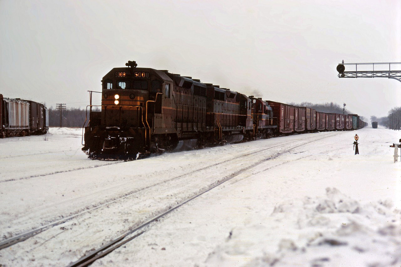 CP 5008 leads another GP35 and an RS3 off of the single track west of "the Junction" into the double track-ABS section of the Galt sub. At the time, the Galt sub was dispatched by timetable and train orders; this is a scheduled train found in the timetable since is is not "displaying signals"