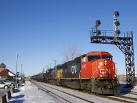 CN 310 has SD70I CN 5616 and ex-CSXT Dash8-40CW GECX 7303 for power as it heads east through Dorval on a clear but cold and windy morning.