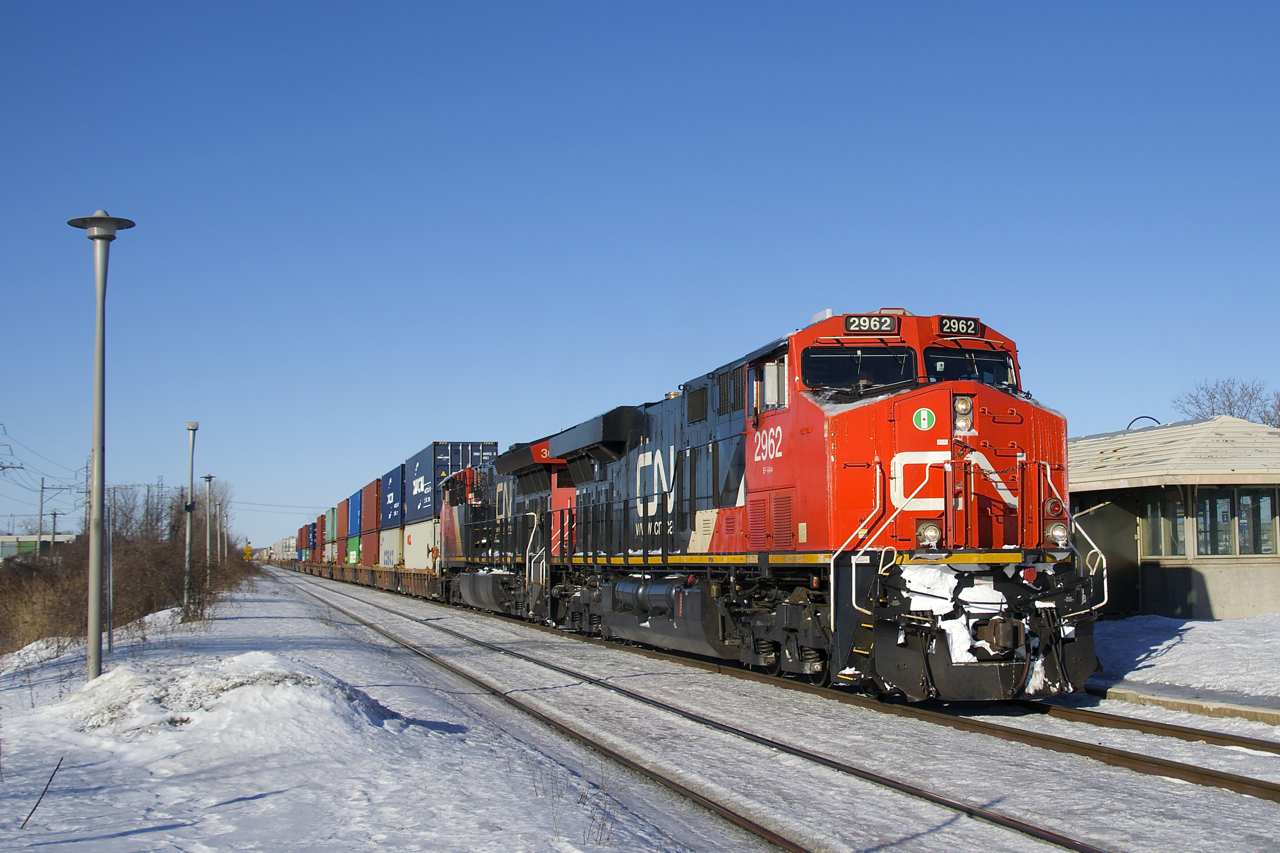 CN 2962 and CN 3012 are the power on CN X106 as it heads east through Dorval.