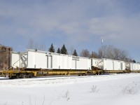 What I believe to be a trio of bridge pieces are seen on CN 305 in St-Henri.