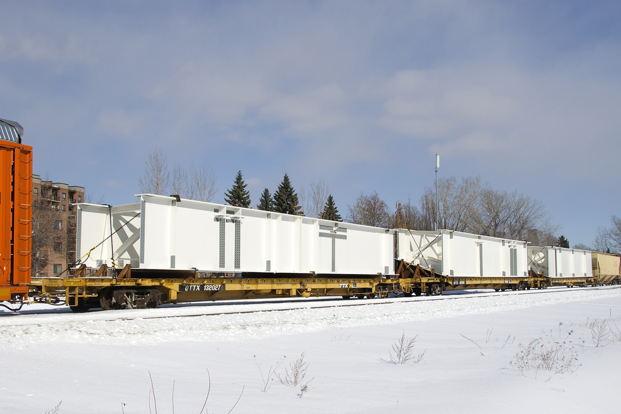 What I believe to be a trio of bridge pieces are seen on CN 305 in St-Henri.