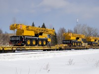 Three Liebherr cranes are on a late CN 305 as it heads west through St-Henri.