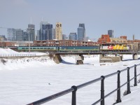 VIA 624 with wrapped VIA 6437 and a Renaissance consist crosses the Lachine Canal in Montreal.