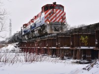 OSR's matching M420W pair with green class lights lit depart Guelph's South end crossing the Eramosa River on an extra weekend run